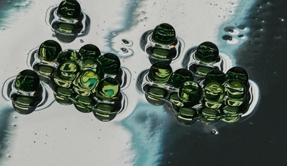 Green glass droplets